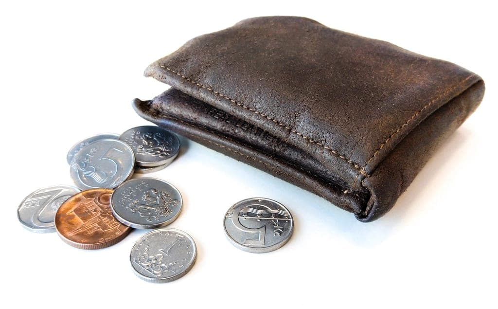 Cash and a wallet on a table
